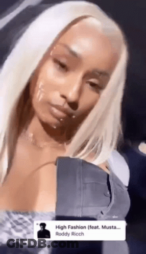 Blonde Woman In Denim Jacket And Necklace GIF