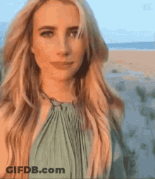 Blonde Woman In Green Dress On Beach GIF