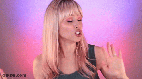 Blonde Woman In Green Tank Top Making Funny Face GIF