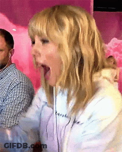 Blonde Woman In Headphones Making Funny Face GIF