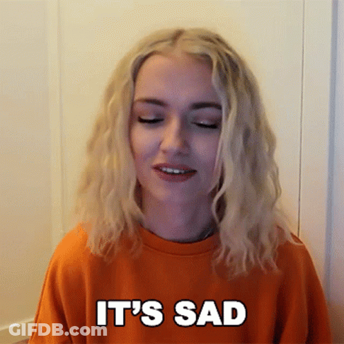 Blonde Woman In Orange Sweatshirt Saying Sad GIF