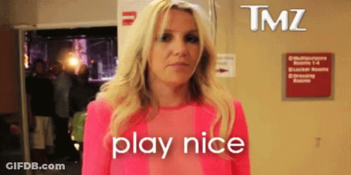 Blonde Woman In Pink Shirt Says Play Nice GIF
