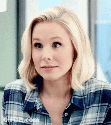 Blonde Woman In Plaid Shirt Making Funny Face GIF