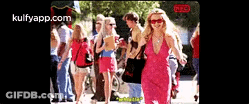 Blonde Woman In Polka Dot Shirt And Black Jacket GIF