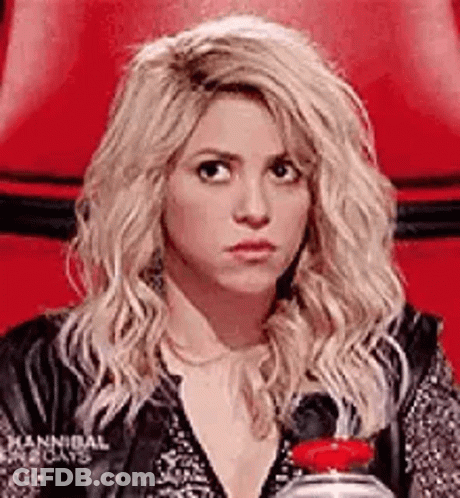 Blonde Woman In Red Chair Holding Water GIF