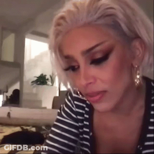 Blonde Woman In Striped Shirt Making Funny Face GIF