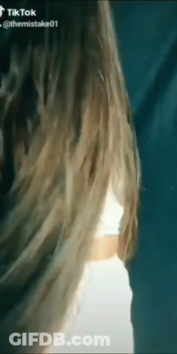 Blonde Woman In White Crop Top And Skirt GIF