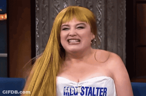 Blonde Woman In White Top Saying Get Me Stalter GIF