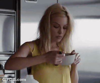 Blonde Woman In Yellow Tank Top Holding White Bowl GIF