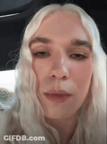 Blonde Woman Looking At Camera GIF