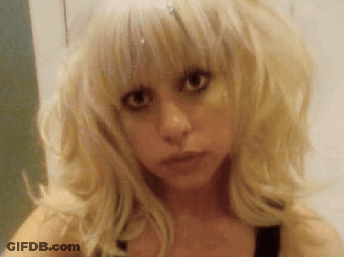 Blonde Woman Looking At Camera Seriously GIF