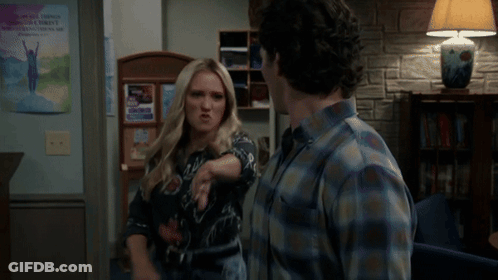 Blonde Woman Making Funny Face In Front Of A Girl Poster GIF