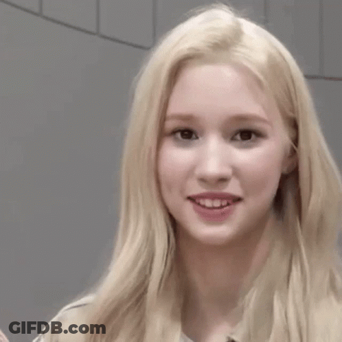 Blonde Woman Making Funny Face Next To Woman GIF