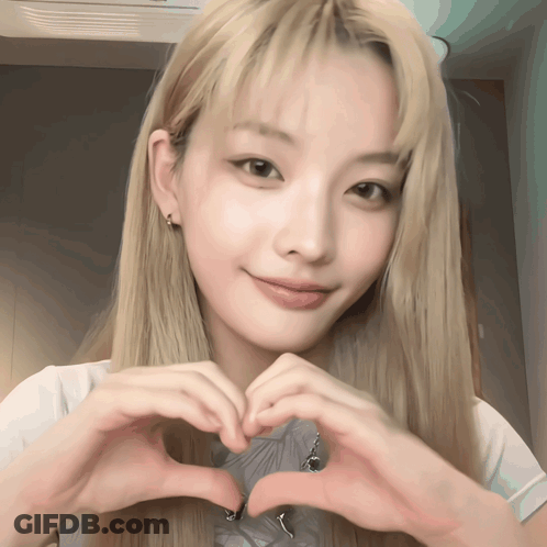 Blonde Woman Making Heart With Hands GIF