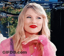 Blonde Woman Pink Shirt Red Lipstick Looking Camera GIF