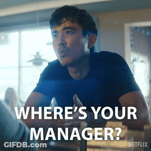 Blonde Woman Saying Because I'm The Manager In Front Of Shelf GIF