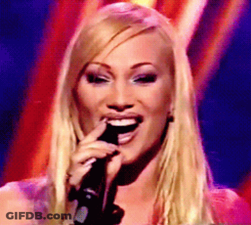 Blonde Woman Singing And Smiling GIF