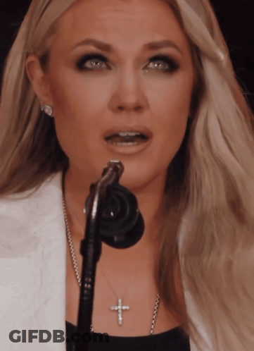 Blonde Woman Singing Into Microphone GIF