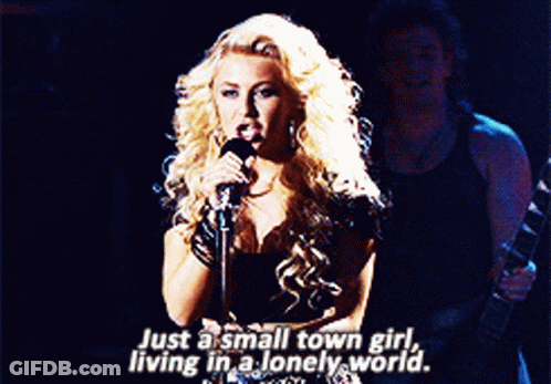 Blonde Woman Singing Just A Small Town Girl GIF