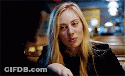 Blonde Woman Sitting At Table Hand On Shoulder GIF