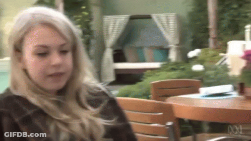 Blonde Woman Sitting At Table GIF