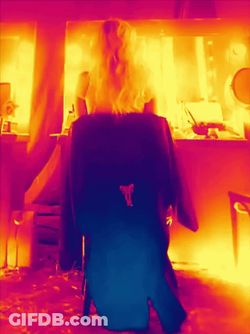 Blonde Woman Sitting In Chair In Dressing Room GIF