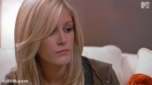 Blonde Woman Sitting On Couch GIF