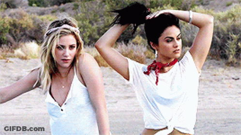 Blonde Woman Sitting With Another Woman GIF