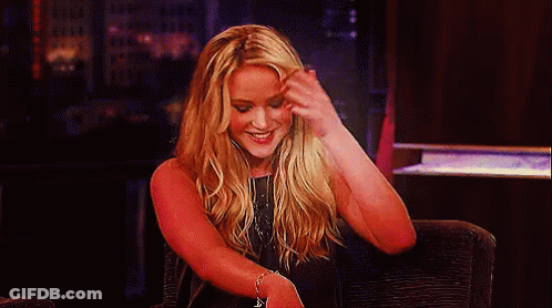 Blonde Woman Sitting With Hand On Face GIF