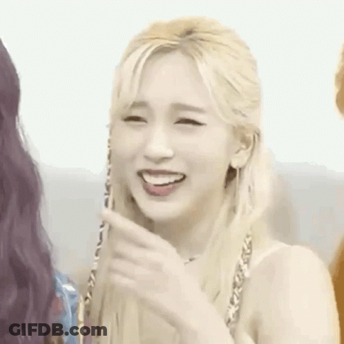 Blonde Woman Smiling And Pointing GIF