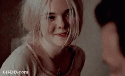 Blonde Woman Smiling At Camera GIF