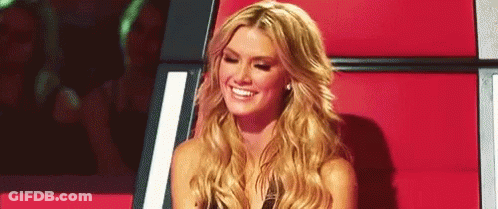 Blonde Woman Smiling In Chair GIF