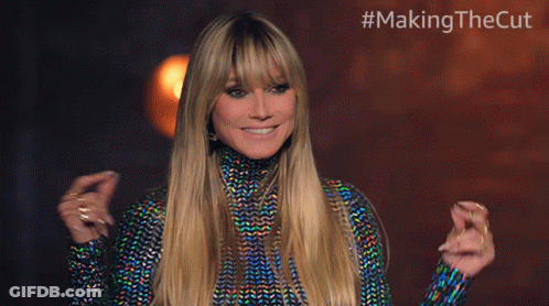 Blonde Woman Smiling In Front Of #MakingTheCut Sign GIF