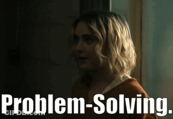 Blonde Woman Standing In Front Of Problem-Solving Sign GIF