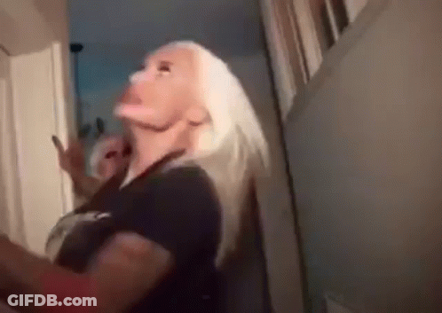 Blonde Woman Standing In Hallway GIF