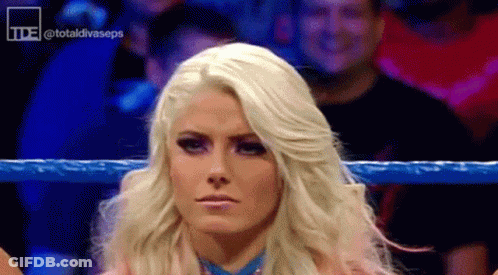 Blonde Woman Standing In Wrestling Ring With Crowd GIF