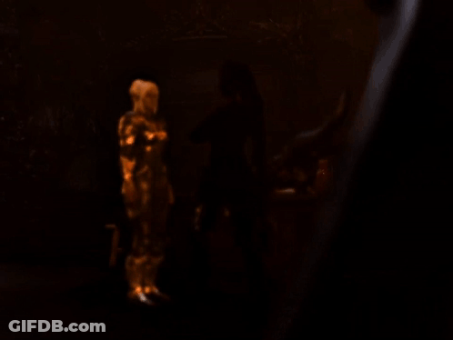 Blonde Woman Wearing Gold Armor GIF