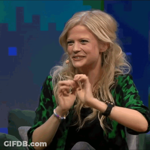 Blonde Woman Wearing Green Shirt And Ikea Watch GIF