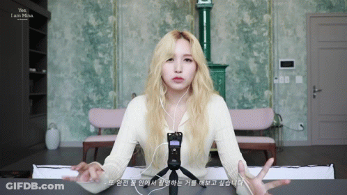 Blonde Woman Wearing Headphones And Microphone Says Yes I Am Mina GIF
