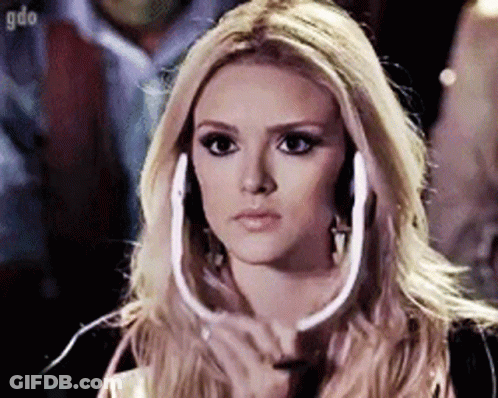 Blonde Woman Wearing Headphones Looking At Camera GIF