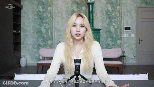 Blonde Woman Wearing Headphones Says Yes I Am Mina GIF