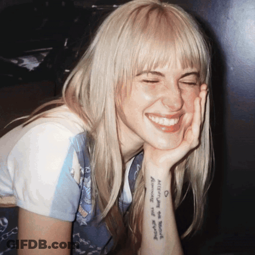 Blonde Woman With Always On Your Mind Tattoo GIF