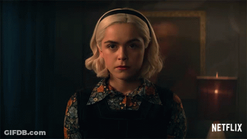 Blonde Woman With Candle And Netflix Logo GIF