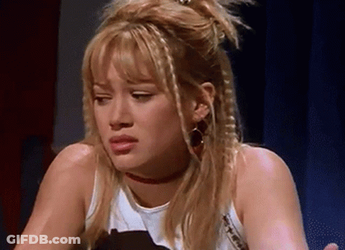 Blonde Woman With Choker Making Face GIF