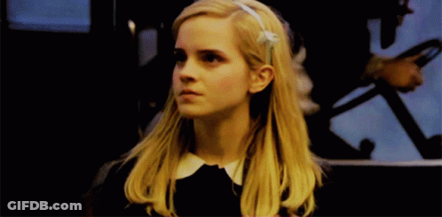 Blonde Woman With Flower In Hair GIF