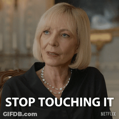 Blonde Woman With Pearl Necklace At Stop Touching It Sign GIF