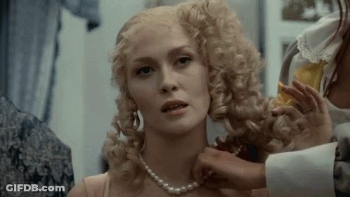 Blonde Woman With Pearl Necklace Getting Hair Done GIF