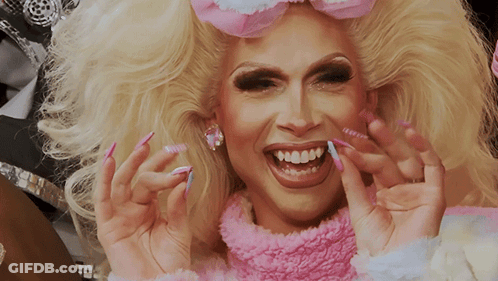 Blonde Woman With Pink Sweater And Nails GIF