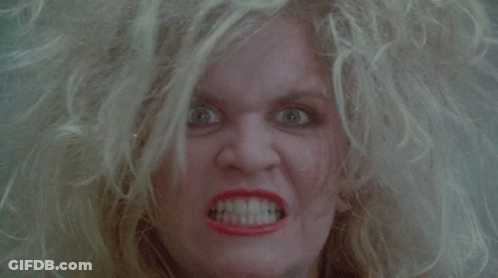 Blonde Woman With Red Lipstick Making Angry Face GIF