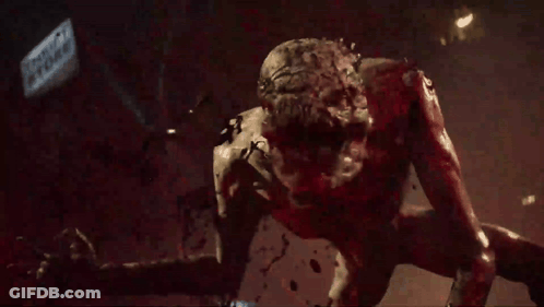 Bloody Monster Crawling In Front Of Tropic Storm Sign GIF
